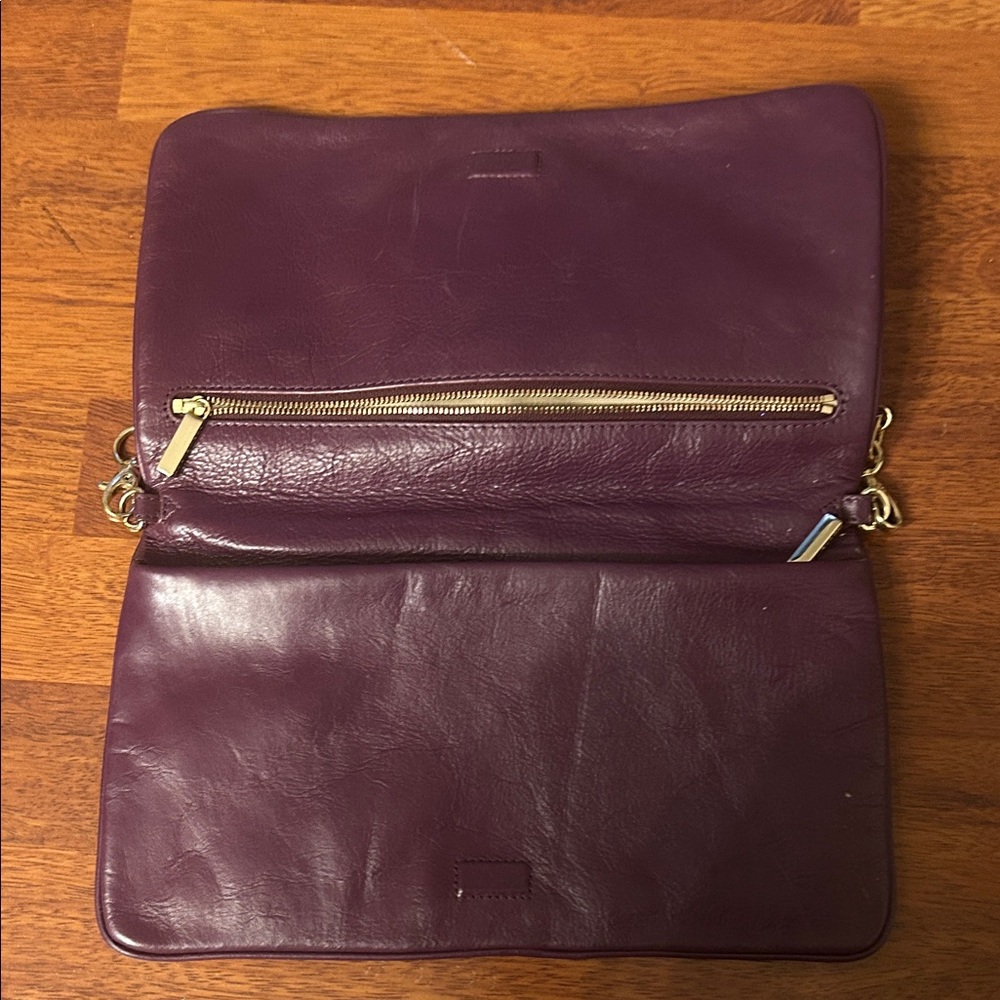 Tory Burch Plum/egg plant Leather Clutch with Gold Accents. - Picture 7 of 16